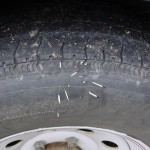 Porcupine needles in tire after close brush with porcupine in road.  Porcupine lived.  Needles stayed in tire for another 70 highway miles.